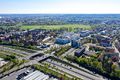 Blick über die Poppenreuther Straße/ Kavierlein mit neuer Bebauung und Schnellrestaurant Vapiano, rechts im Bild Hotel und Pestalozzi-Schulbau, April 2019