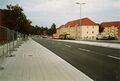 Blick von der <!--LINK'" 0:179--> zur Kreuzung Friedrich-Ebert-Straße,  links befindet sich die  <!--LINK'" 0:180-->. Rechts sanierte Häuserzeile Würzburger Straße 95+93+91. Vergleichsfoto mit selben Motiv von 1975. Aufnahme vom September 2004.