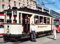 historische <!--LINK'" 0:223--> der Baureihe 800 von 1935 mit klassischer Lackierung und Beschriftung der "Nürnberg-Fürther Straßenbahn" zwischen Wappen und Kleeblatt vom Straßenbahnmuseum St. Peter im August <a class="mw-selflink selflink">2010</a>