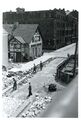 Reifen-Reichel in der Langen Straße - im Hintergrund das Gebäude Finkenstraße 6 d, 1955