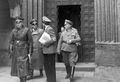 Der Generalgouverneur des besetzten Polen Hans Frank zu Besuch in Thorn, im Bild Adolf Schwammberger ... <span class="smw-highlighter" data-type="8" data-state="inline" data-title="Hinweis" title="Der Generalgouverneur des besetzten Polen Hans Frank zu Besuch in Thorn, im Bild Adolf Schwammberger (mit Rücken zur Kamera), rechts OB Franz Jakob, links Gauleiter Albert Forster, ca. 1942Urheber: Kurt Grimm NürnbergLizenz: CC BY-SA 3.0"><span class="smwtticon note"></span><span class="smwttcontent">Der Generalgouverneur des besetzten Polen Hans Frank zu Besuch in Thorn, im Bild Adolf Schwammberger (mit Rücken zur Kamera), rechts OB Franz Jakob, links Gauleiter Albert Forster, ca. 1942<br>Urheber: Kurt Grimm Nürnberg<br><br>Lizenz: CC BY-SA 3.0</span></span>
