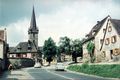Würzburger Straße in Burgfarrnbach, ca. 1960 <span class="smw-highlighter" data-type="8" data-state="inline" data-title="Hinweis" title="Urheber: unbekanntLizenz: CC BY-SA 3.0"><span class="smwtticon note"></span><span class="smwttcontent">Urheber: unbekannt<br><br>Lizenz: CC BY-SA 3.0</span></span>
